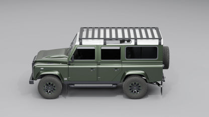 Seitenansicht: Schwarzer, modularer Dachträger montiert auf einem Land Rover Defender 110.