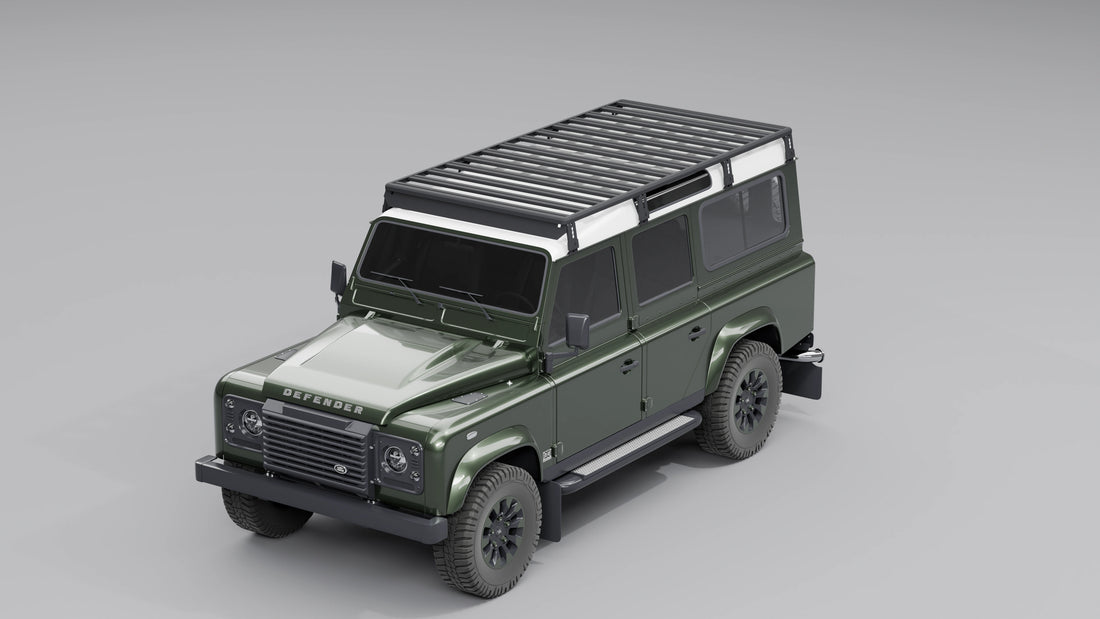 Modularer Dachträger in Schwarz, montiert auf einem klassischen dunkelgrünen Land Rover Defender 110.